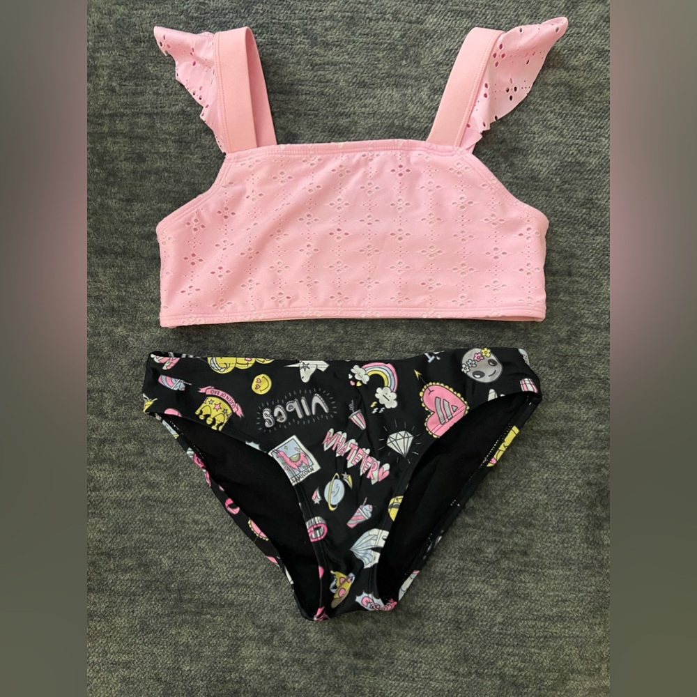 Cat and Jacks pink top with ruffles paired with The Children’s Place bottoms.